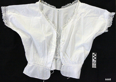 White cotton short sleeved camisole with lace trim and drawstring peplum waist