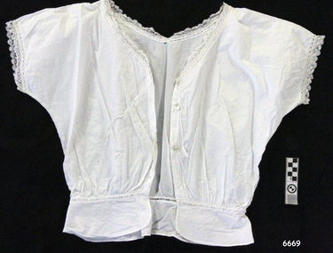 White cotton camisole with short sleeves and button through front, lace trim