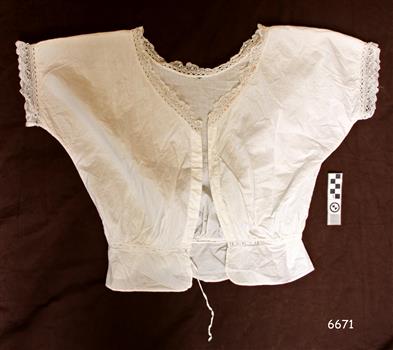 Camisole has short sleeves and lace trim at neck and sleeves