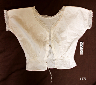 Camisole has short sleeves and lace trim at neck and sleeves