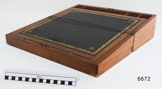 Hinged wooden box with leather surface and compartments