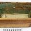 Drawer has newspaper on the base and green paper lining on the sides