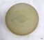 Centre of cap liner has a raised knob and ridge in the centre