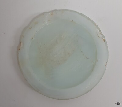 Other side of milky blue disc is smoother