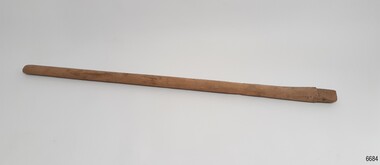 Wooden length of timber, oval crosscut, with shaped end