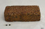 Brick has uneven sides and shows a variety of materials in the clay