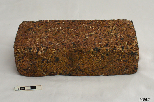 Brick has uneven sides and shows a variety of materials in the clay