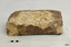 Concretion on brick is white and has uneven edges