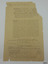 Yellow-brown paper with printed and handwritten text