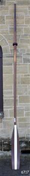 Timber oar with blade painted brown and white