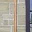 wooden oar with painted blade, brown and white