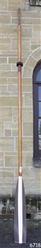 wooden oar with painted blade, brown and white
