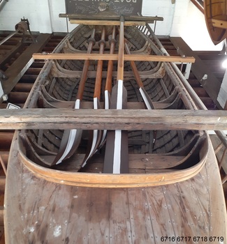 Four oars within the surf boat