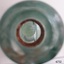 Close-up from mouth of bottle towards enclosed marble