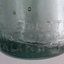 Close-up of thick uneven base with inscriptions