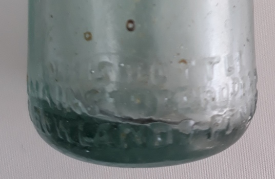 Close-up of thick uneven base with inscriptions