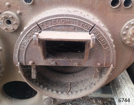 Inscription is cast into metal plate over an opening