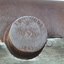 Inscription is impressed into metal give details of the place and year of manufacture.
