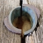 Metal cylinder, or collar, in two halves is fixed inside the hole of the compressor plate and overlaps the top