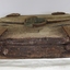 Timber and metal fixtures are flaking and fragile. The centre of the top piece of timber is worn and concave.