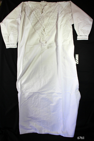 White nightgown with long straight body and long sleeves. Lace decoration