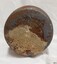 Base has stain and encrustations, and impressed inscription