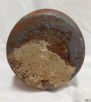 Base has stain and encrustations, and impressed inscription