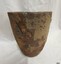 Crucible has a long line indented into the clay