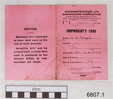 Pink covered card with printed form inside, completed with handwritten details