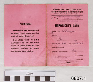 Pink covered card with printed form inside, completed with handwritten details