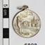 Medal is engraved with text and images