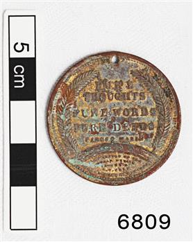Medal has text and wreath image decoration
