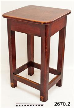 Wooden rectangular stool with bracing rails