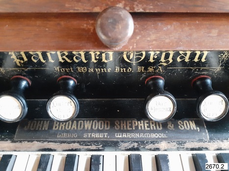 Retailer's details in gold, added above keyboard