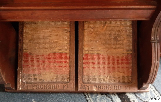 Maker's name on base of carpet-covered pedals