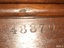 Serial number, five digits, stamped into wood