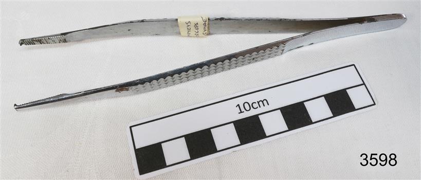 Stainless steel forceps with L shaped ends.