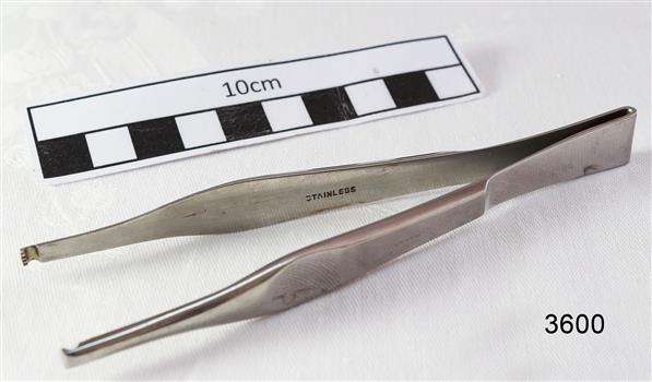 Stainless steel forceps with L shaped ends.