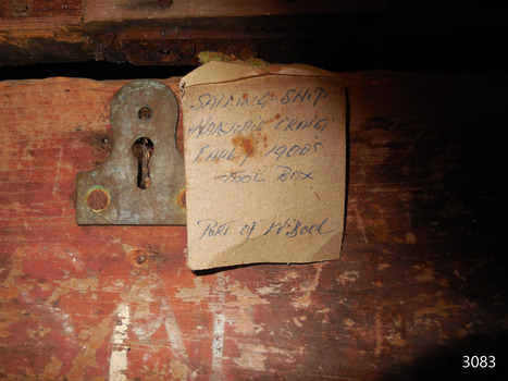 Cardboard tag with inscriptions identifying the toolbox