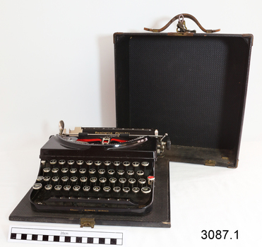 Case for typewriter is fitted. Lid removes completely. Typewriter can be used when on its base.