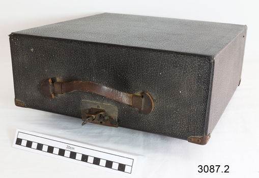 Typewriter case has carry handle and key to  secure it.