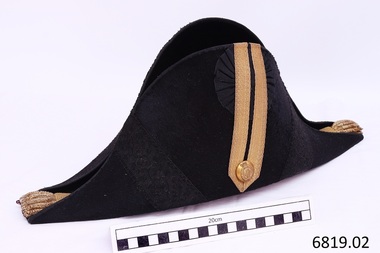 Black bicorn hat with gold braid and buttons