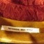 Name is embroidered on white tape