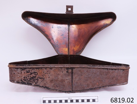 Lid is shiny copper, outer case has remnants of black paint