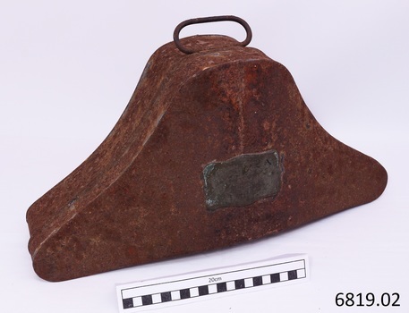 Tin case with plaque attached (unreadable) and carry handle on top