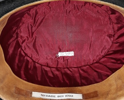 Crown of hat has crimson lining inside