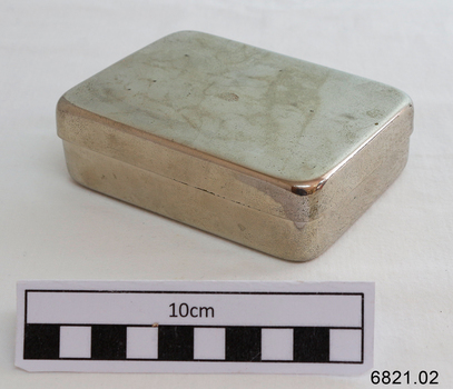 A small silver rectangular container 