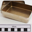 Inside the small silver rectangular container 