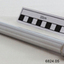 A long metal tube containing 3 copper coloured medical instruments 