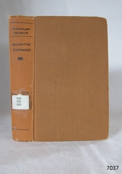 Book in a copper colour with the title in black text